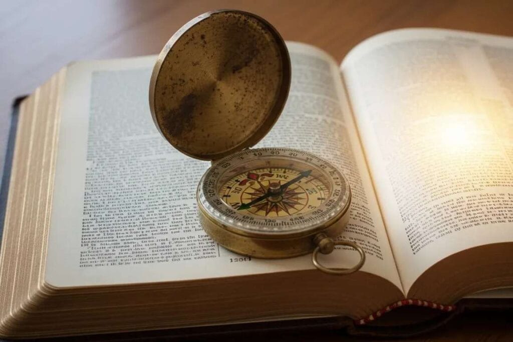 Uma bússula sobre um Bíblia aberta - A Fidelidade de Deus e o Chamado à Perseverança
