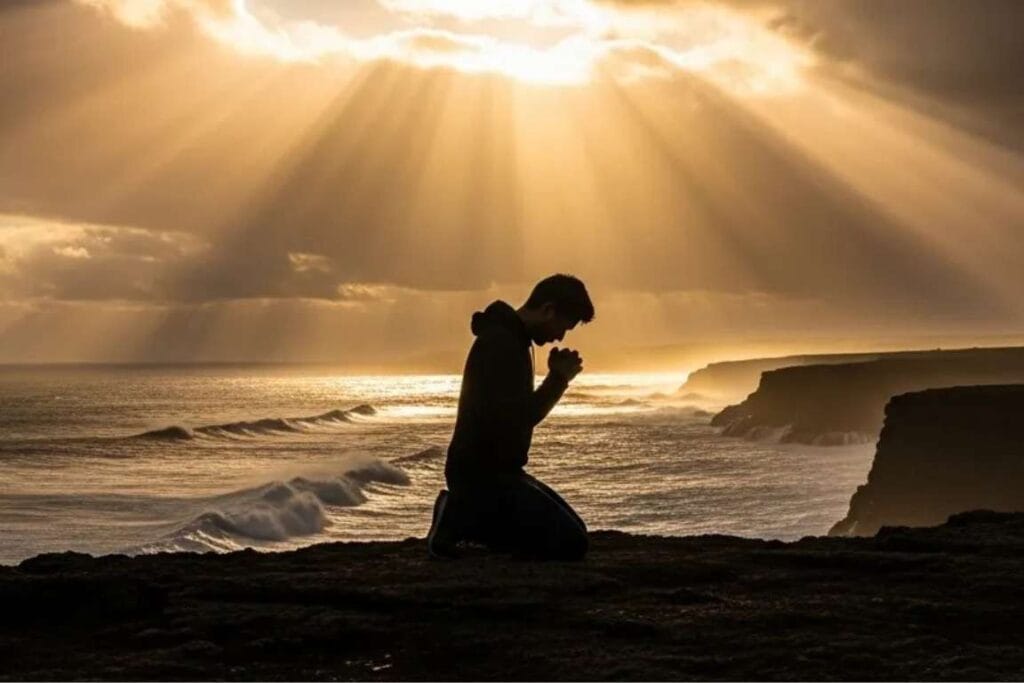 Homem ajoelhado próximo ao mar - o que é amor